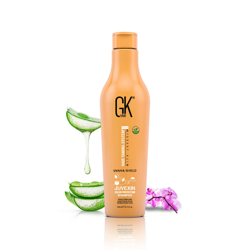 GK Hair Shield Shampoo, 240 ml orange Juvexin Color Protection bottle with sliced aloe vera and a purple orchid