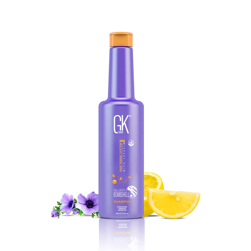 GK Hair Silver Bombshell Shampoo Pro, 280 ml purple flip-top bottle beside purple anemones and lemon slices