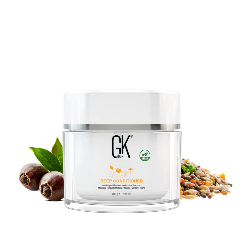 GK Hair Deep Conditioner Hair Treatment Pro 200 g clear jar of hair masque beside jojoba nuts, leaves and grain extracts